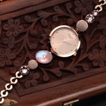 Raga Women's Charm: Elegant Mother of Pearl Dial with Ornate Strap Watch